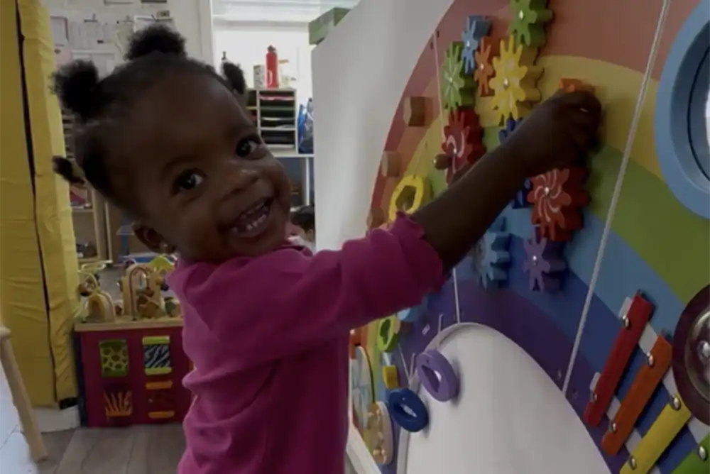 a young child playing at preschool